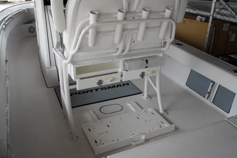 Slide: The Image of 2027 Sportsman Masters 247OE Bay Boat interior with rod holders and storage compartments. - 7