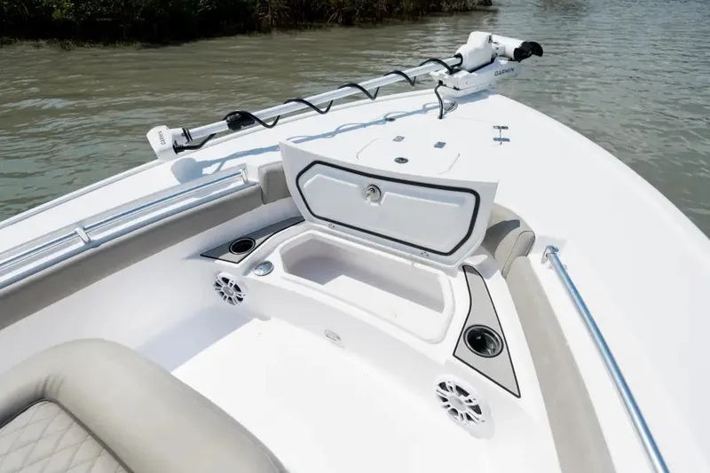 Slide: The Image of 2027 Sportsman Masters 247OE Bay Boat with open storage compartment and sleek design. - 11