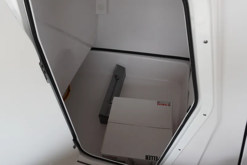 Slide: The Image of Storage compartment inside 2027 Sportsman Masters 247OE Bay Boat, featuring Yamaha equipment. - 18