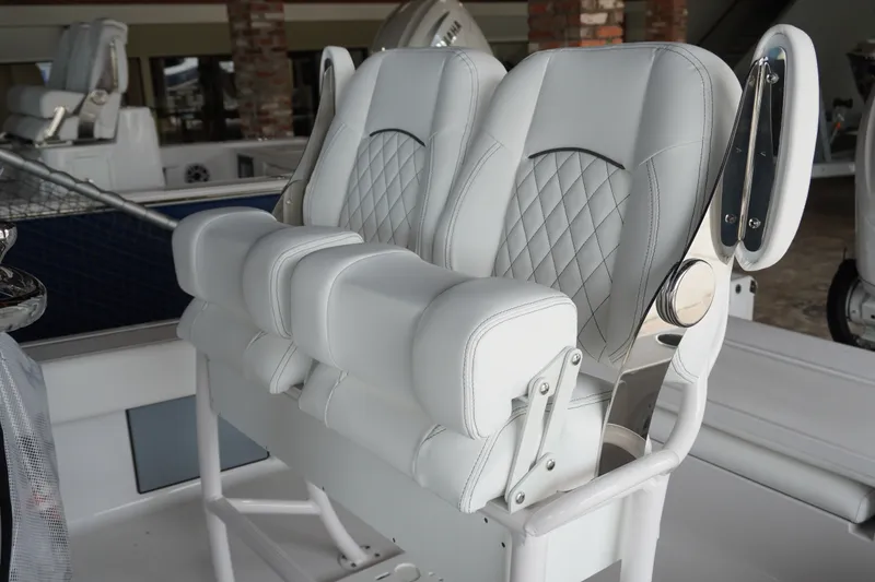 Slide: The Image of Luxurious seating on 2027 Sportsman Masters 247OE Bay Boat with diamond-stitched upholstery. - 8