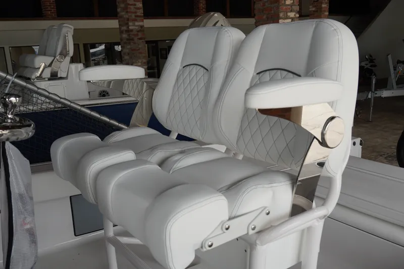 Slide: The Image of Luxurious seating on a 2027 Sportsman Masters 247OE Bay Boat, featuring white cushioned seats. - 9
