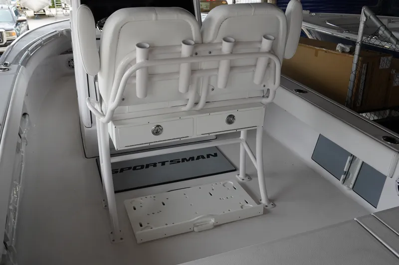 Slide: The Image of 2027 Sportsman Masters 247OE Bay Boat interior with seating and storage compartments. - 5