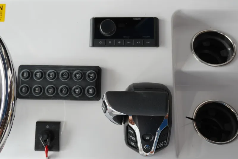 Slide: The Image of Control panel of 2027 Sportsman Masters 247OE Bay Boat with switches and throttle. - 11