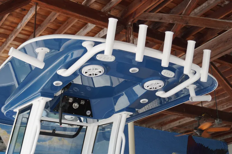 Slide: The Image of 2027 Sportsman Masters 247OE Bay Boat T-top with rod holders and speakers. - 6