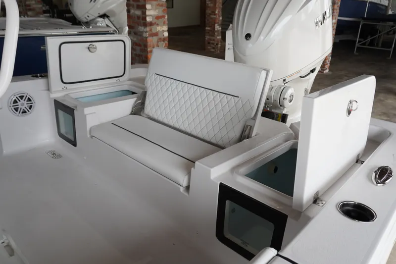 Slide: The Image of 2027 Sportsman Masters 247OE Bay Boat interior with seating and storage compartments. - 4
