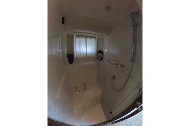 Slide: The Image of Shower area inside 2007 Sea Ray 44 Sundancer yacht, featuring sleek design and fixtures. - 64