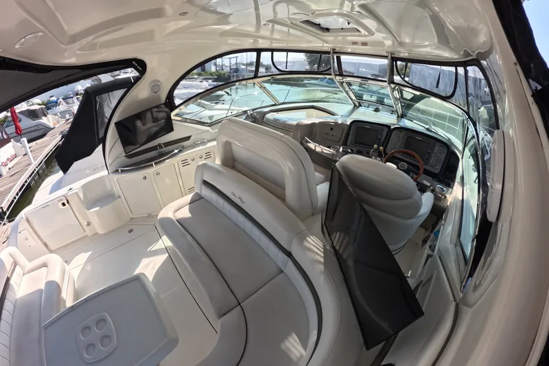 Slide: The Image of Luxurious 2007 Sea Ray 44 Sundancer yacht interior with plush seating and modern dashboard. - 21