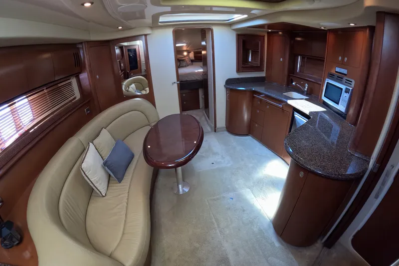 Slide: The Image of Luxurious interior of 2007 Sea Ray 44 Sundancer yacht with kitchen and seating area. - 27