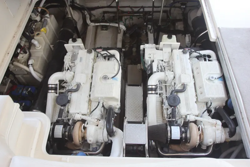 Slide: The Image of Engine compartment of 2007 Sea Ray 44 Sundancer, showcasing dual inboard engines. - 77