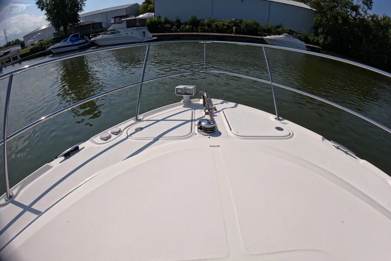 Slide: The Image of Bow view of 2007 Sea Ray 44 Sundancer yacht docked in a marina. - 15