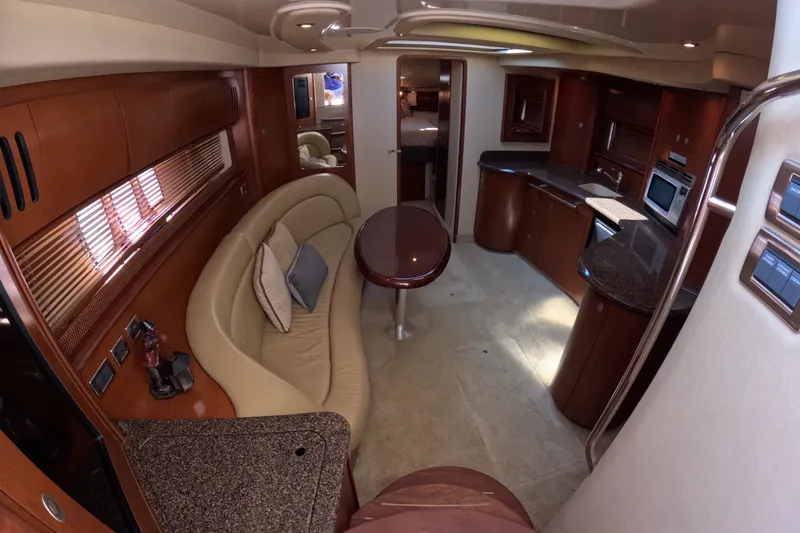 Slide: The Image of Luxurious interior of 2007 Sea Ray 44 Sundancer yacht with elegant seating and modern kitchen. - 26
