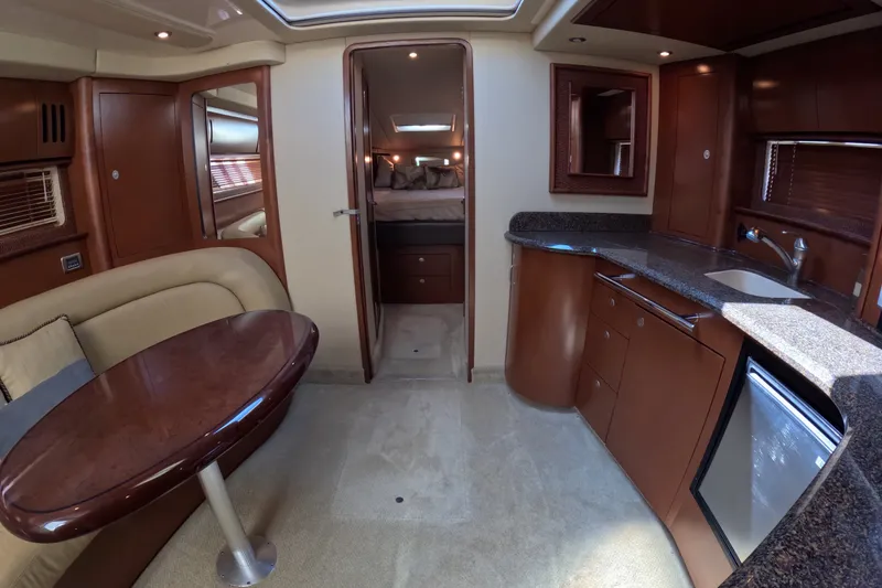Slide: The Image of Luxurious interior of 2007 Sea Ray 44 Sundancer yacht with elegant wood finishes. - 31