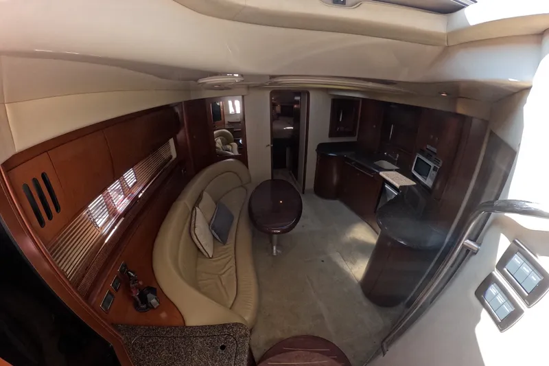 Slide: The Image of Luxurious interior of a 2007 Sea Ray 44 Sundancer yacht with elegant seating and kitchen area. - 50