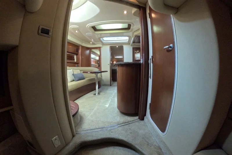 Slide: The Image of Interior of 2007 Sea Ray 44 Sundancer yacht, featuring elegant seating and wood finishes. - 72