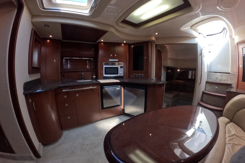 Slide: The Image of Luxurious 2007 Sea Ray 44 Sundancer yacht interior with modern kitchen and elegant wood finishes. - 66