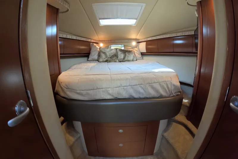 Slide: The Image of Luxurious cabin interior of 2007 Sea Ray 44 Sundancer yacht with cozy bed and elegant wood finish. - 32
