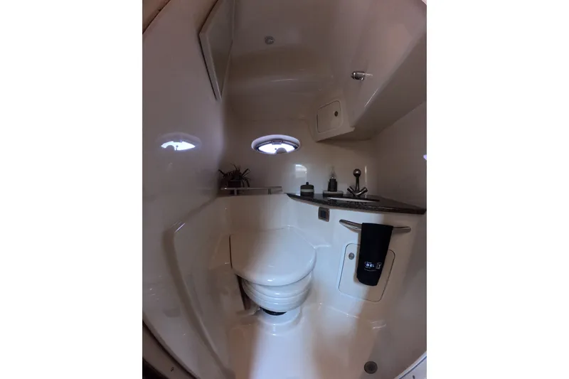 Slide: The Image of Bathroom interior of 2007 Sea Ray 44 Sundancer yacht, featuring modern fixtures and porthole windows. - 75