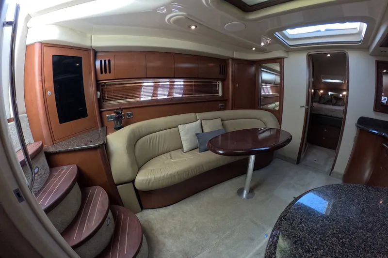 Slide: The Image of Luxurious interior of 2007 Sea Ray 44 Sundancer yacht with plush seating and elegant wood finishes. - 54