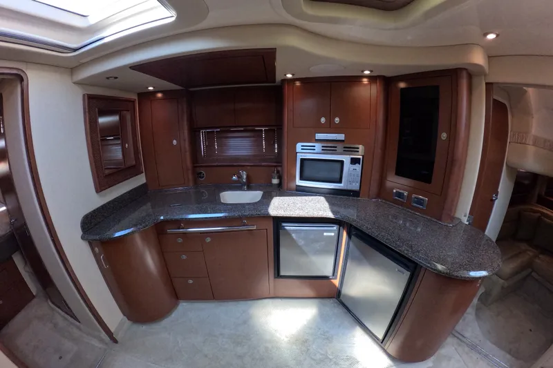 Slide: The Image of Luxurious 2007 Sea Ray 44 Sundancer yacht kitchen with modern appliances and sleek cabinetry. - 68