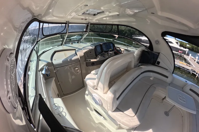 Slide: The Image of 2007 Sea Ray 44 Sundancer yacht interior with luxurious seating and navigation controls. - 8
