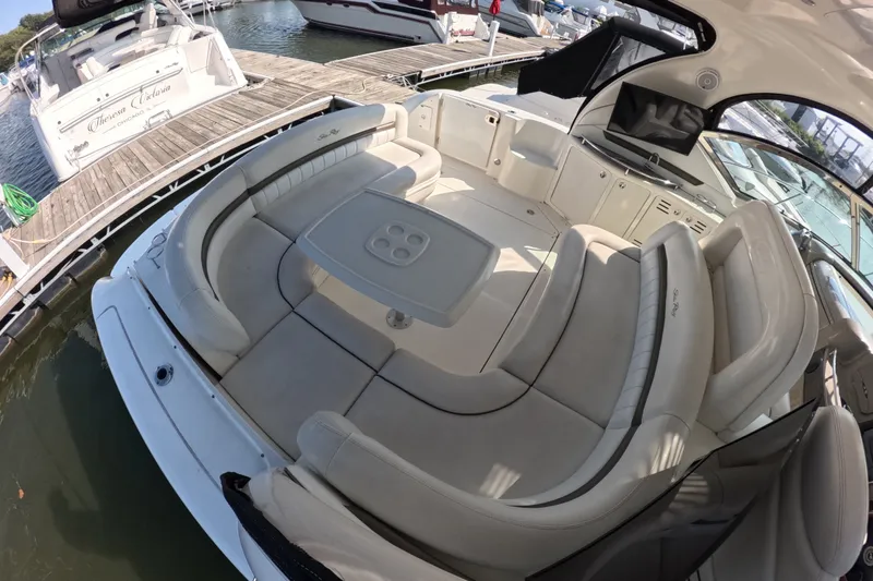 Slide: The Image of 2007 Sea Ray 44 Sundancer yacht with spacious seating and table at the dock. - 22