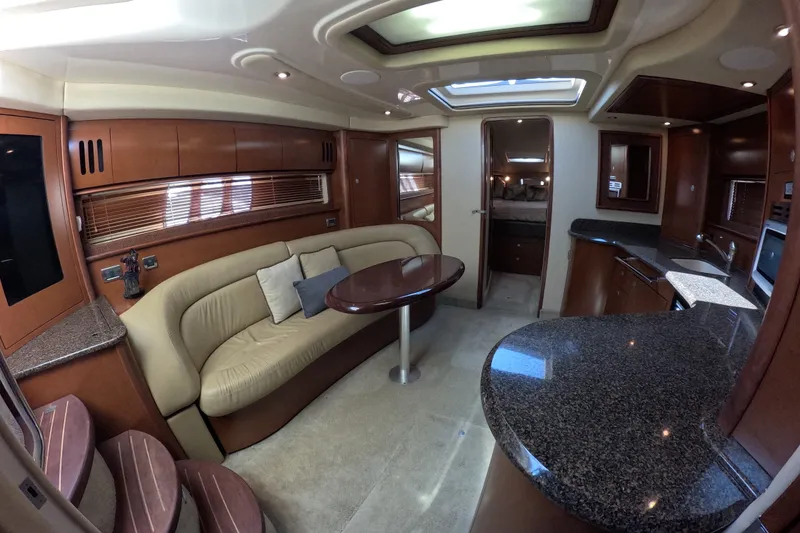 Slide: The Image of Luxurious interior of 2007 Sea Ray 44 Sundancer yacht with elegant seating and modern kitchen. - 53