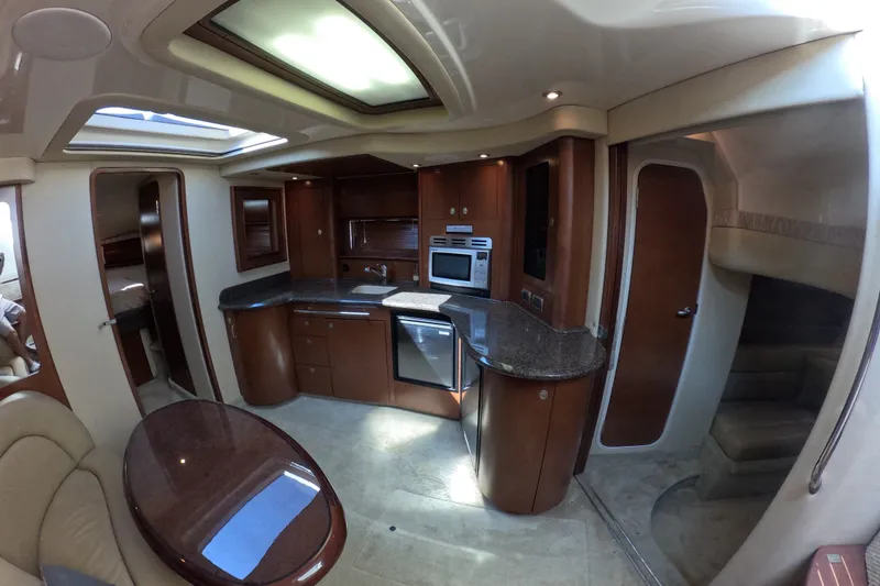 Slide: The Image of Luxurious interior of a 2007 Sea Ray 44 Sundancer yacht with modern kitchen amenities. - 55