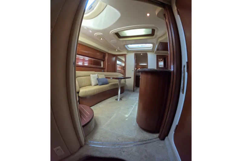 Slide: The Image of Interior of 2007 Sea Ray 44 Sundancer yacht, featuring elegant seating and skylight. - 46