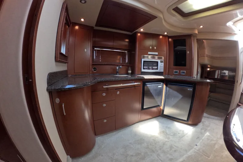 Slide: The Image of Luxurious kitchen interior of 2007 Sea Ray 44 Sundancer yacht with modern appliances. - 67