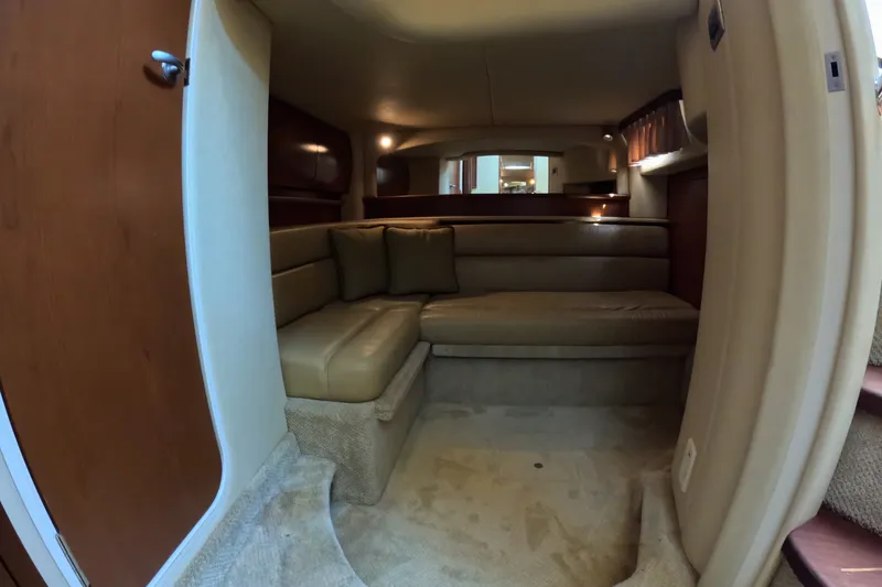 Slide: The Image of Interior of 2007 Sea Ray 44 Sundancer yacht with beige seating and wooden accents. - 42