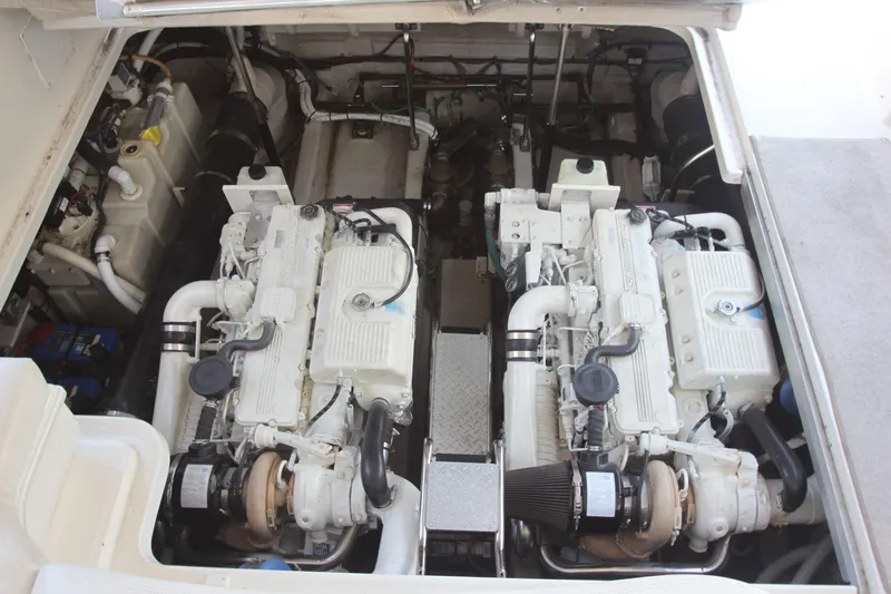 Slide: The Image of Engine compartment of a 2007 Sea Ray 44 Sundancer with dual engines. - 76