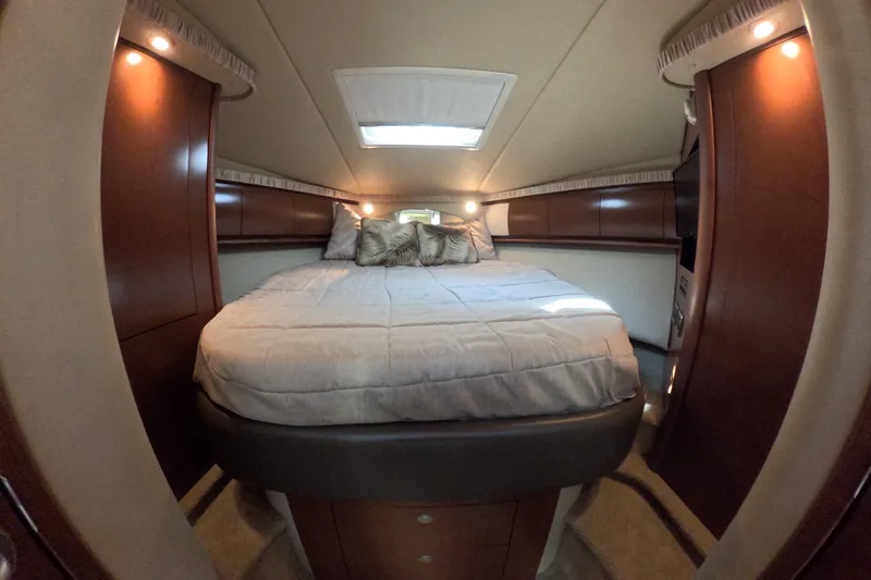 Slide: The Image of Luxurious cabin interior of 2007 Sea Ray 44 Sundancer yacht with cozy bed and elegant wood finish. - 57