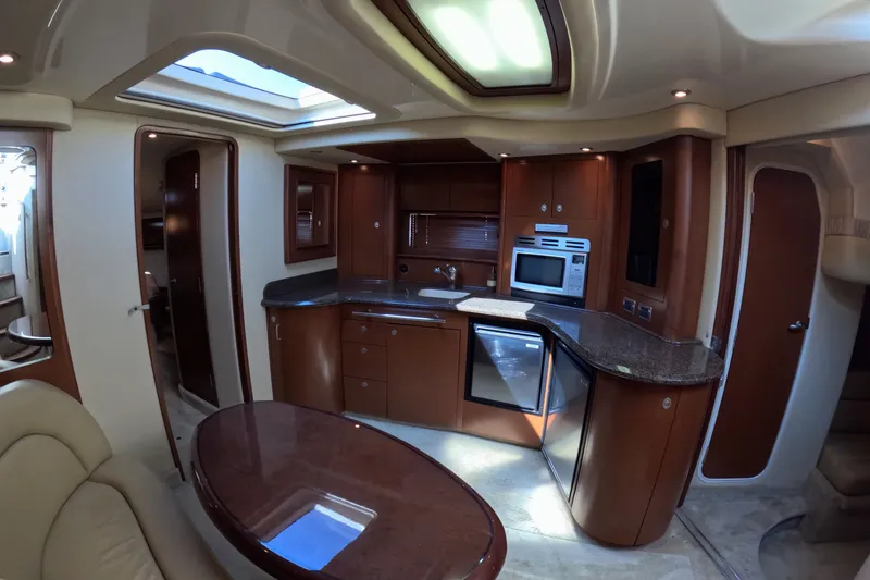 Slide: The Image of Luxurious interior of a 2007 Sea Ray 44 Sundancer yacht with modern kitchen amenities. - 30