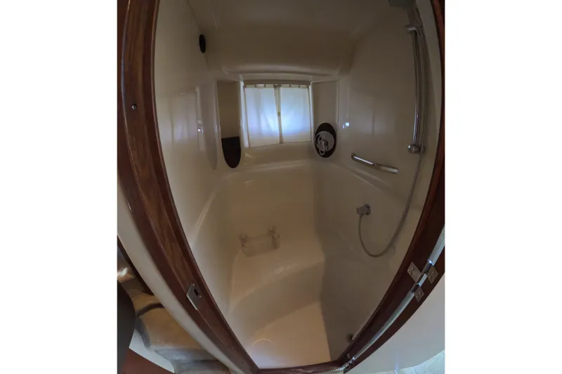 Slide: The Image of Shower area inside 2007 Sea Ray 44 Sundancer yacht, featuring sleek design and fixtures. - 38