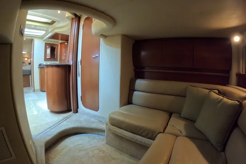 Slide: The Image of Luxurious interior of a 2007 Sea Ray 44 Sundancer yacht, featuring plush seating and elegant wood finishes. - 44
