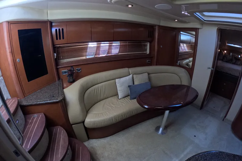Slide: The Image of Luxurious interior of 2007 Sea Ray 44 Sundancer yacht with plush seating and elegant wood finishes. - 29