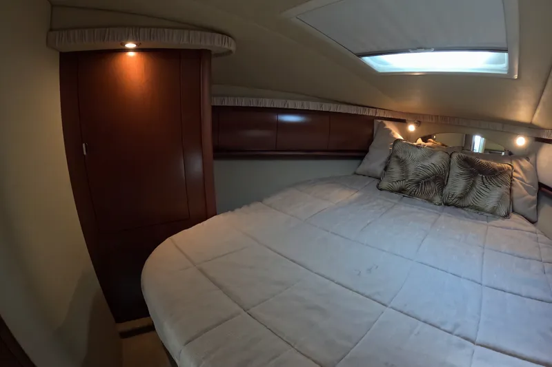 Slide: The Image of Luxurious cabin interior of 2007 Sea Ray 44 Sundancer yacht with cozy bedding. - 34