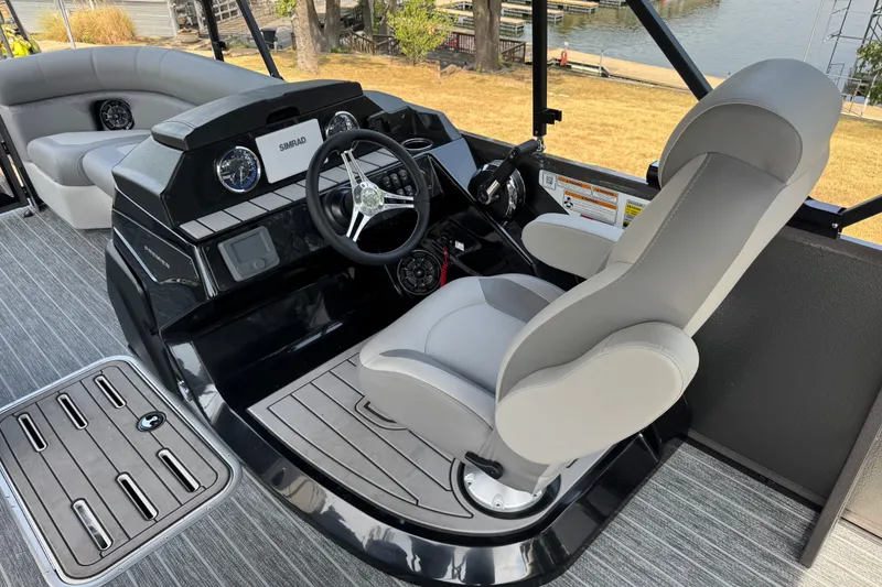 Slide: The Image of 2027 Premier 230 Sunsation RL - CL boat interior with steering console and seating. - 7