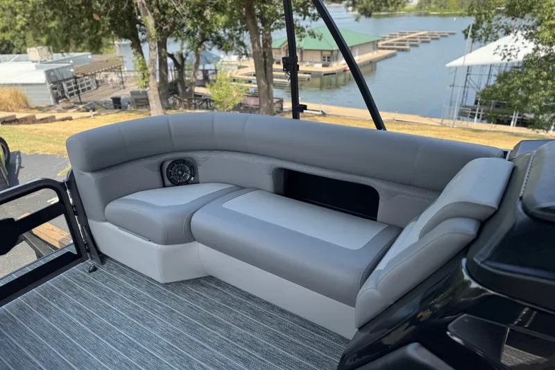 Slide: The Image of Luxurious seating on 2027 Premier 230 Sunsation RL - CL pontoon boat by the lake. - 10