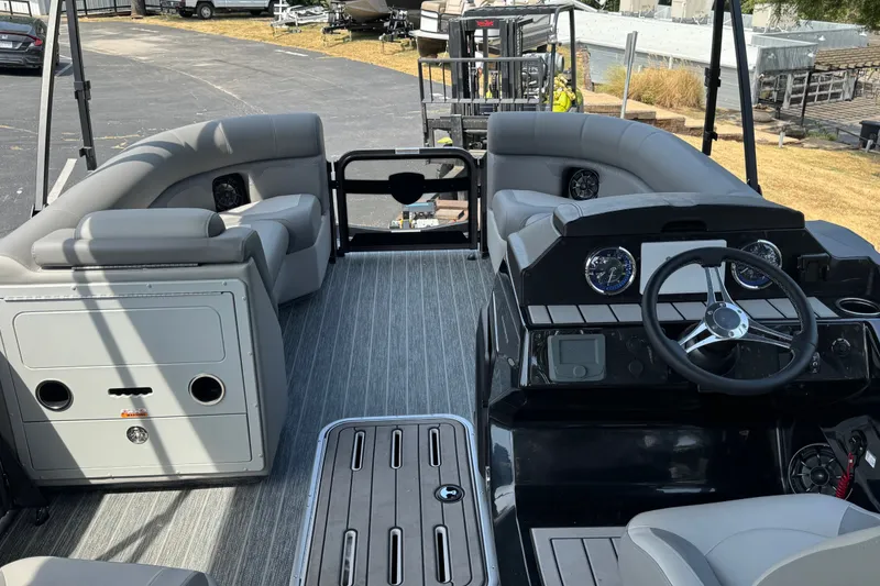 Slide: The Image of Interior of 2027 Premier 230 Sunsation RL - CL pontoon boat with modern seating and controls. - 4