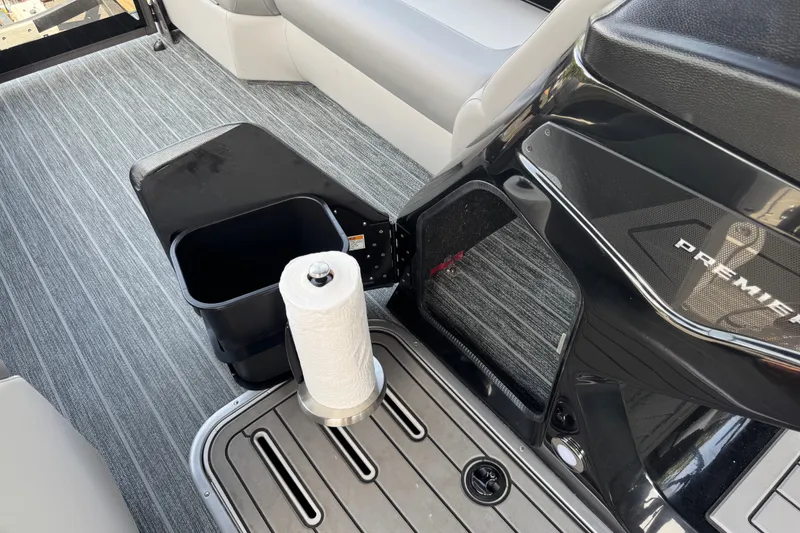 Slide: The Image of Interior of 2027 Premier 230 Sunsation RL - CL boat with paper towel holder and storage bin. - 16