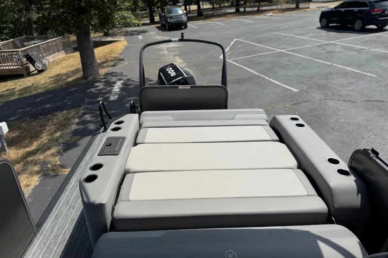 Slide: The Image of Premier 230 Sunsation RL - CL 2027 boat interior with cushioned seating and cup holders. - 8