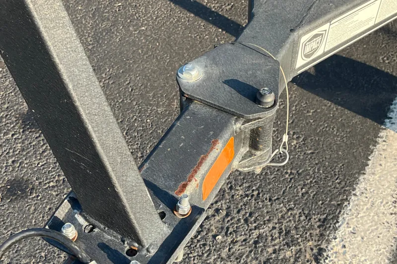 Slide: The Image of Trailer hitch of 2020 Tracker Targa V-19 WT Tournament Edition on asphalt surface. - 18