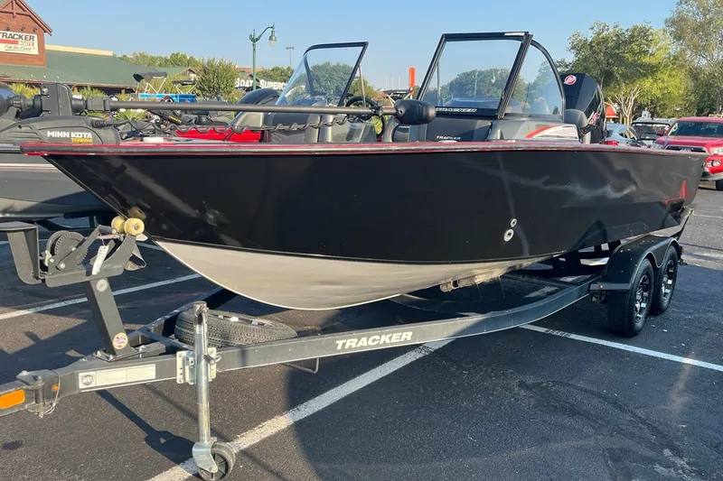 The Image of 2020 Tracker Targa V-19 WT Tournament Edition boat on trailer in parking lot. - 0