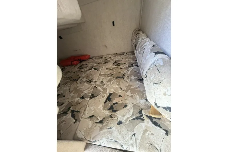 Slide: The Image of Interior cabin of 2000 Sea Ray 240 Sundancer with patterned upholstery. - 15