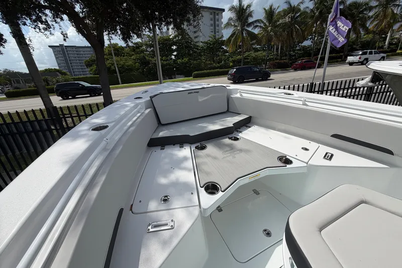 Slide: The Image of 2026 Sea Pro 245FLXR Sandbar boat interior with seating and storage compartments. - 10