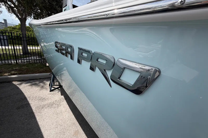 Slide: The Image of 2026 Sea Pro 245FLXR Sandbar boat side view with logo in focus. - 4