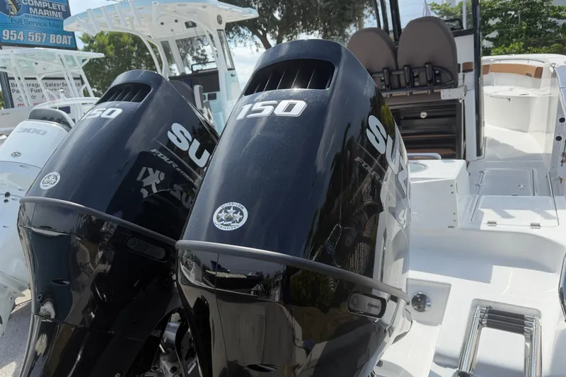 Slide: The Image of 2027 Sea Pro 262 DLX boat with dual Suzuki 150 outboard motors. - 6