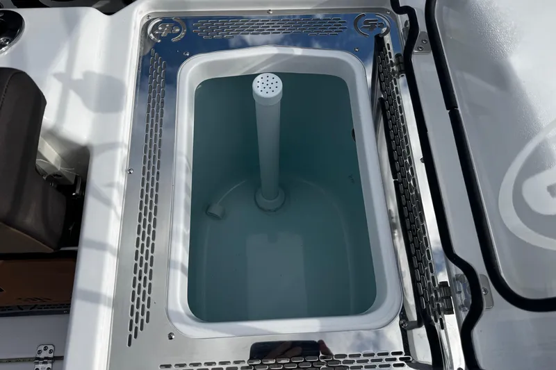 Slide: The Image of Livewell compartment on 2026 Sea Pro 292 DLX boat, featuring a sleek design. - 13