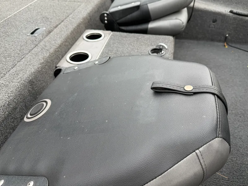 Slide: The Image of Close-up of a boat seat with cup holders and gray upholstery. - 15